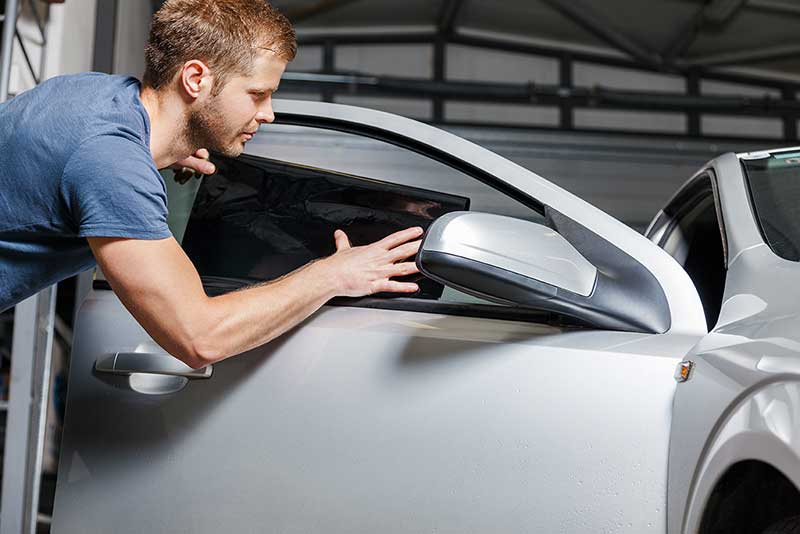 applying-tinting-foil-onto-a-car-window